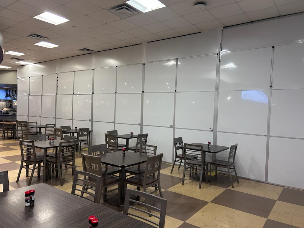 University renovation containment with temporary walls installed at multiple ceiling heights.