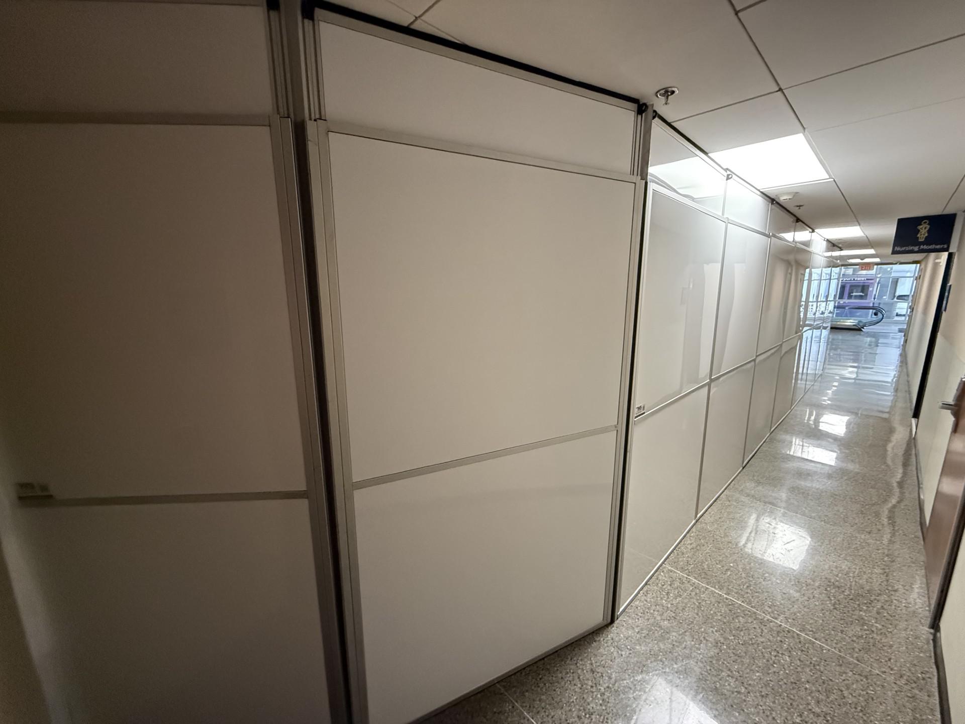 Airport renovation containment wall in an active public corridor