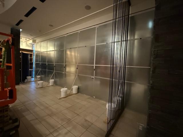 Professional hotel renovation containment with branded wall graphics at The Westin Austin Downtown