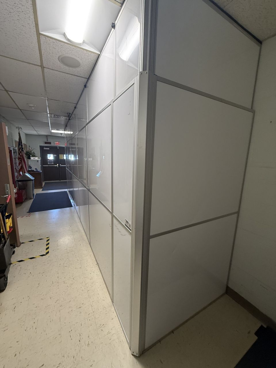 Modular hard wall containment supporting occupied government facility renovations near active operations at Tinker Air Force Base