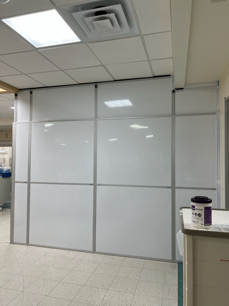 Healthcare containment wall system separating hospital renovation work from occupied emergency department areas at Keesler Air Force Base Medical Center.