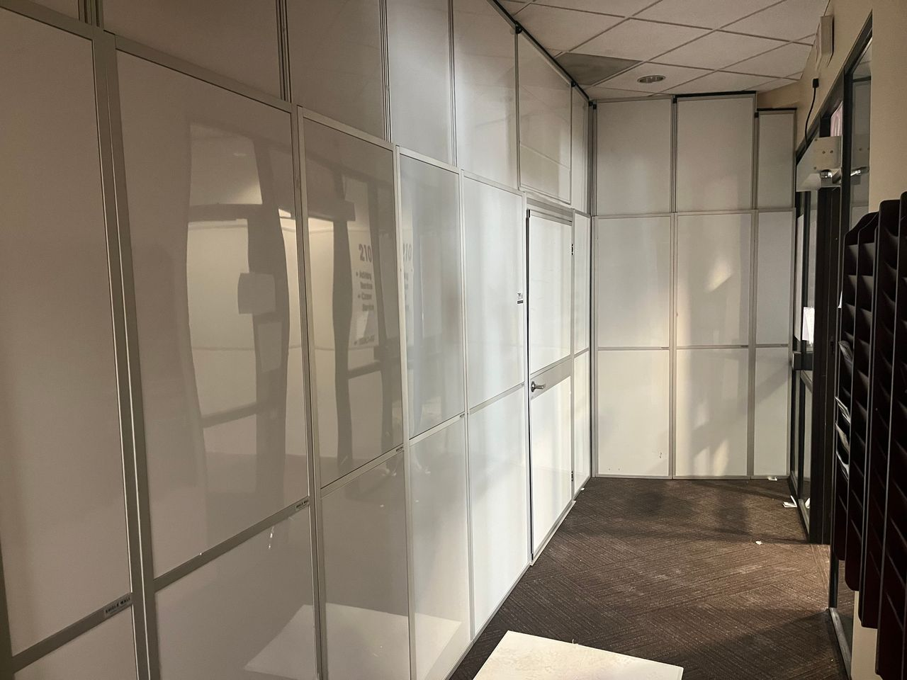 Interior view of modular hard wall containment installed by Temporary Wall Systems to separate a Student Union renovation from occupied campus space at North Idaho College.