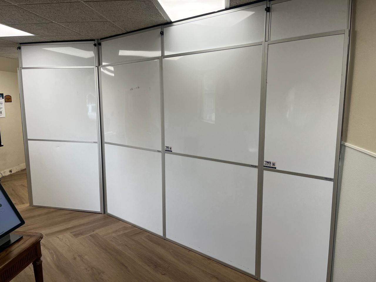 Temporary construction walls creating a fully enclosed healthcare containment area during lobby and HVAC renovations at an occupied assisted living community.