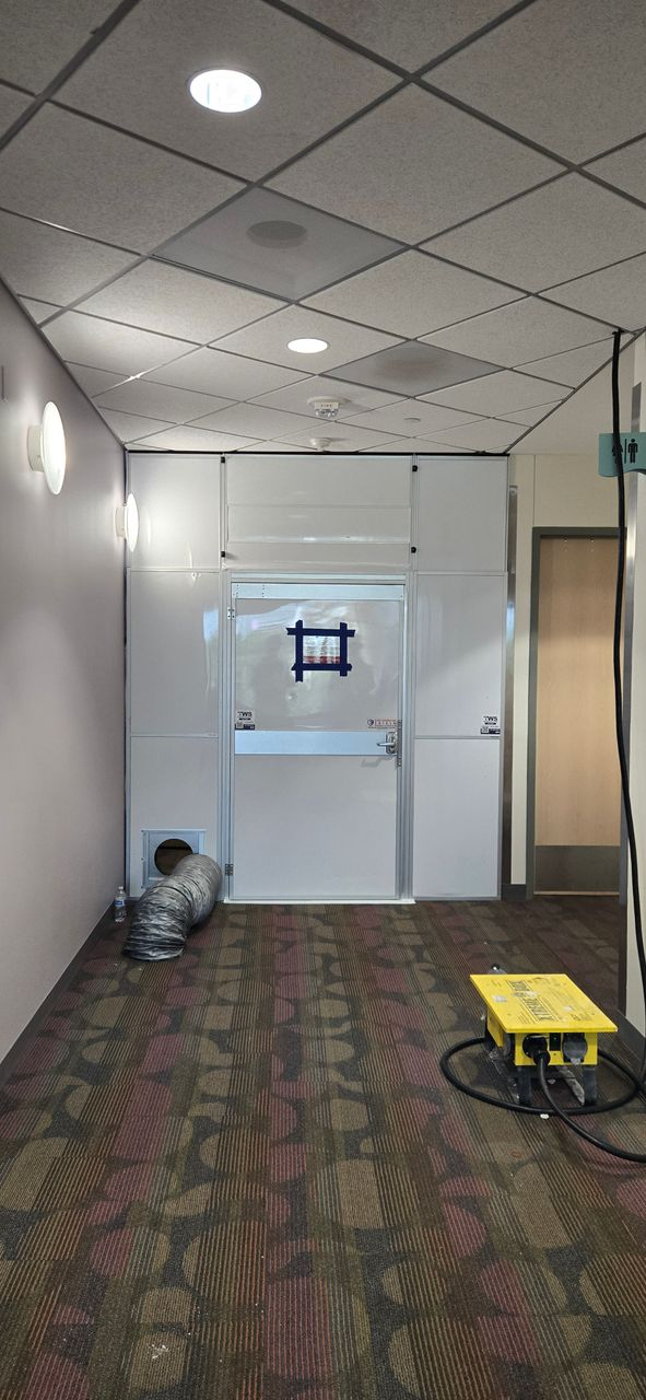 Modular hard wall containment with integrated access door and air-management duct installed in a healthcare corridor at Children’s Health Plano.