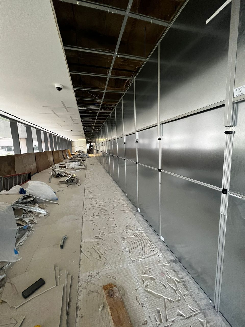 Modular hard wall construction containment separating demolition and renovation activity from adjacent areas at Galleria Office Tower I in North Dallas.