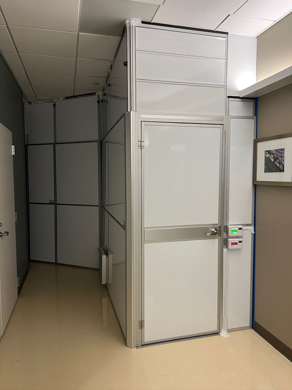 Temporary Wall Systems modular hard wall containment corridor with integrated door and ICRA healthcare containment during cancer center renovation in New Orleans