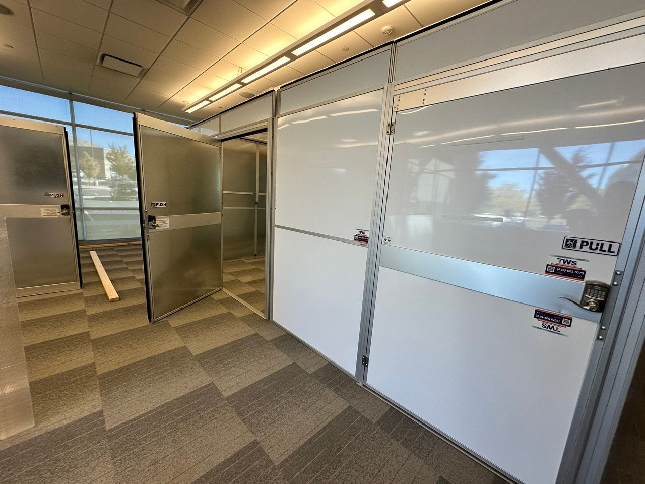Temporary Wall Systems modular hard wall containment configured as private healthcare consultation rooms for an employee health clinic in Salt Lake City.