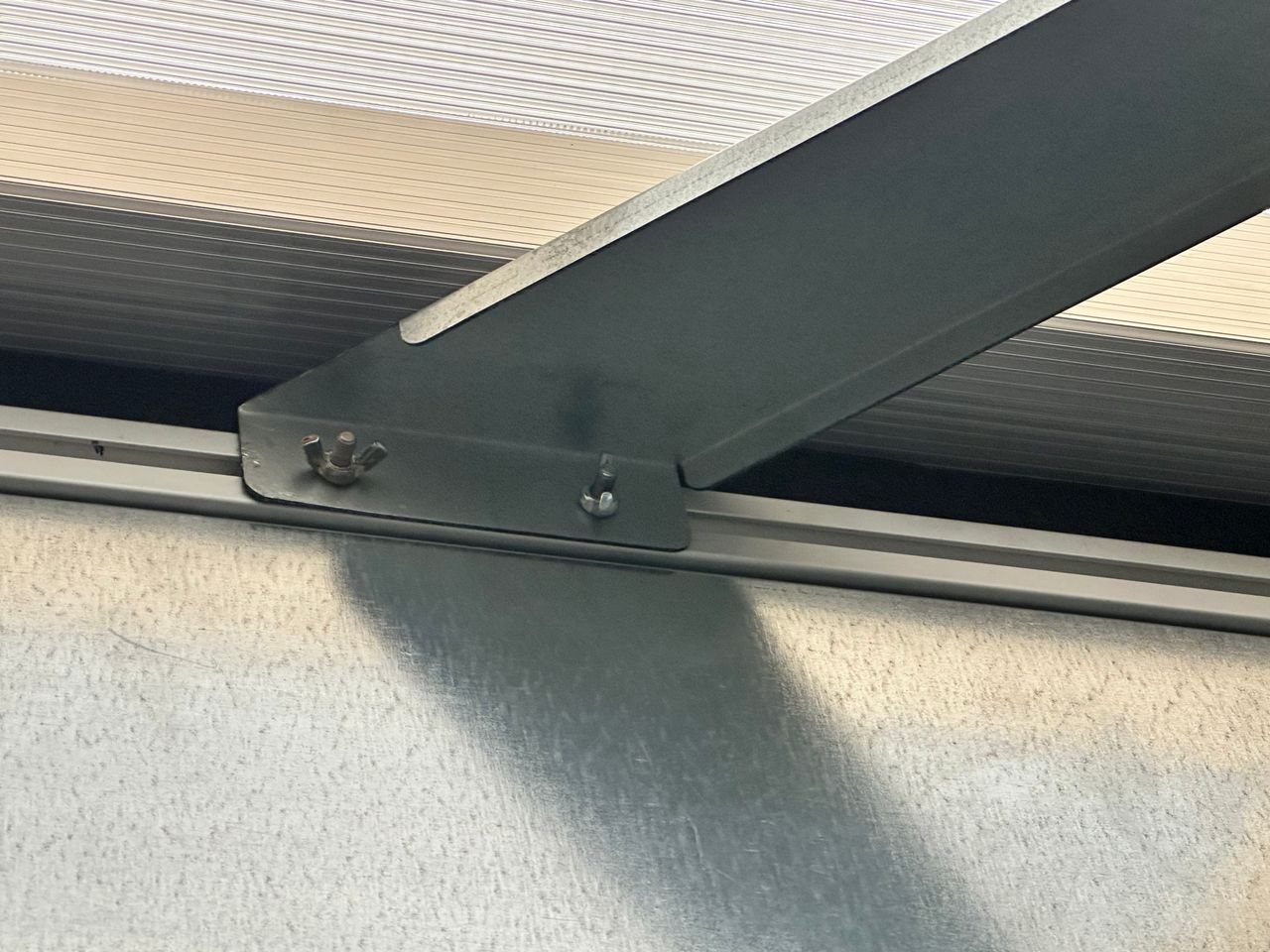 Clear ceiling support system used in Temporary Wall Systems modular healthcare containment to improve acoustic privacy and create professional clinical spaces.