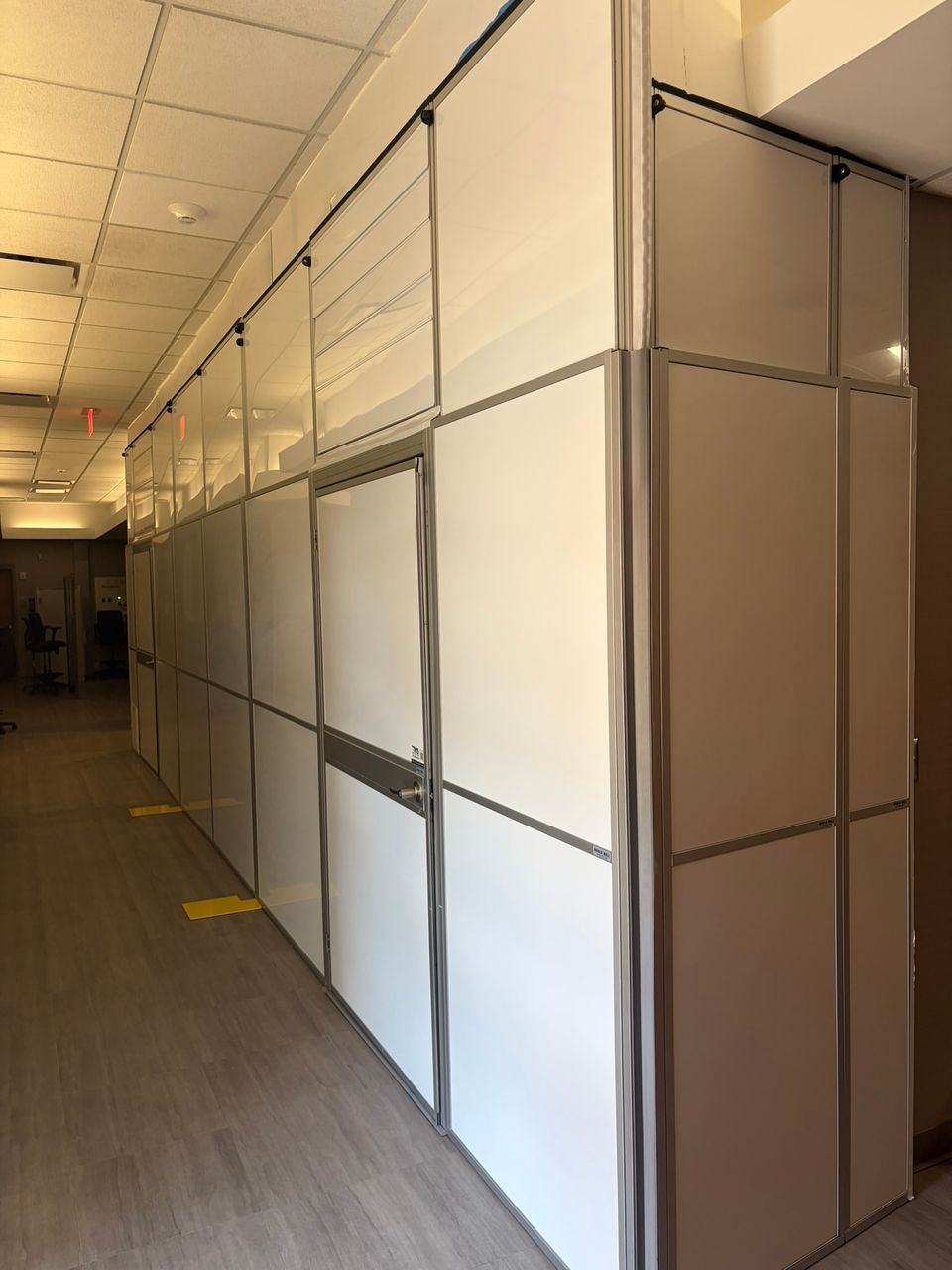 Temporary Wall Systems modular hard wall containment creating a secure construction barrier inside a healthcare facility while maintaining operational continuity and infection control measures.