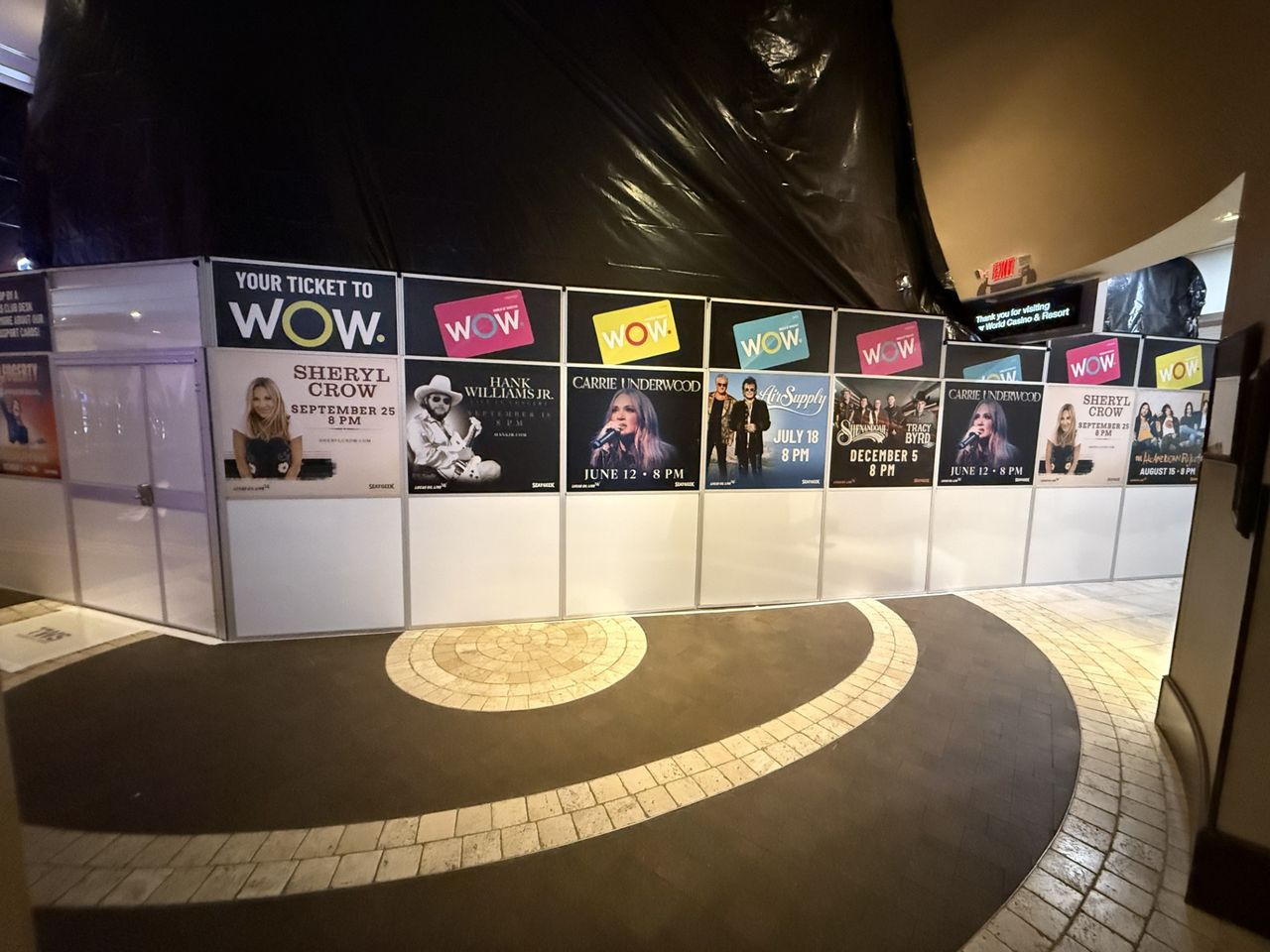 Temporary construction wall with reusable custom graphic panels installed at WinStar World Casino Resort to separate guests from active renovation work.