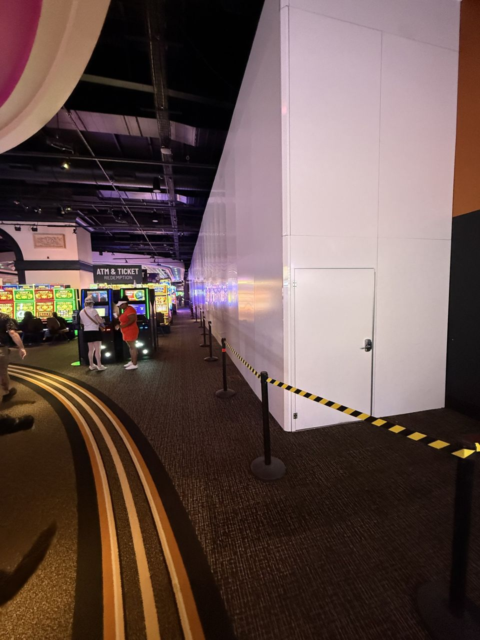 Modular hard wall containment system with integrated access door and concealed dust cap installed for renovation containment at WinStar World Casino Resort.