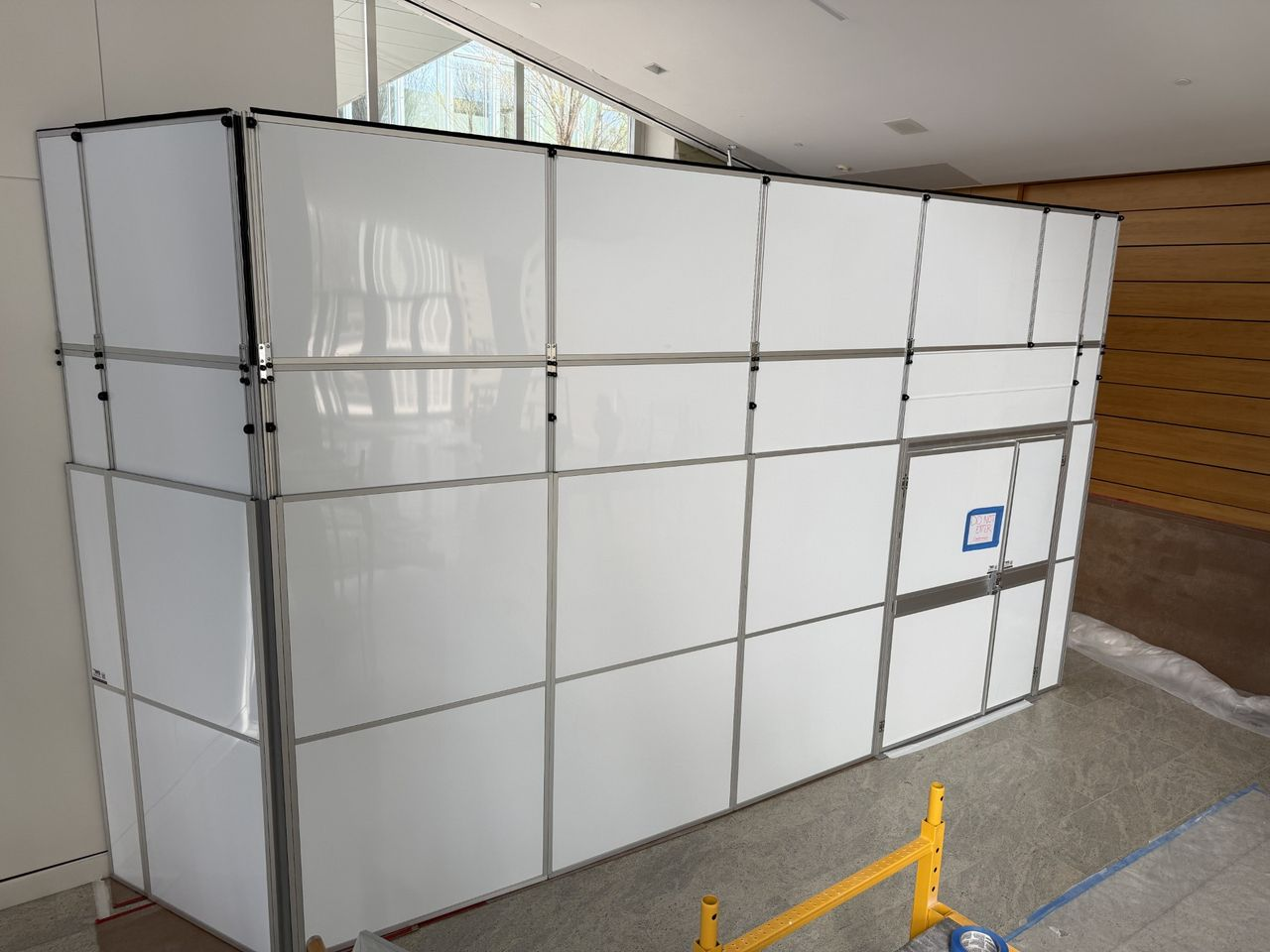 Temporary Wall Systems dust-tight construction containment installed in a high-profile occupied event venue lobby renovation