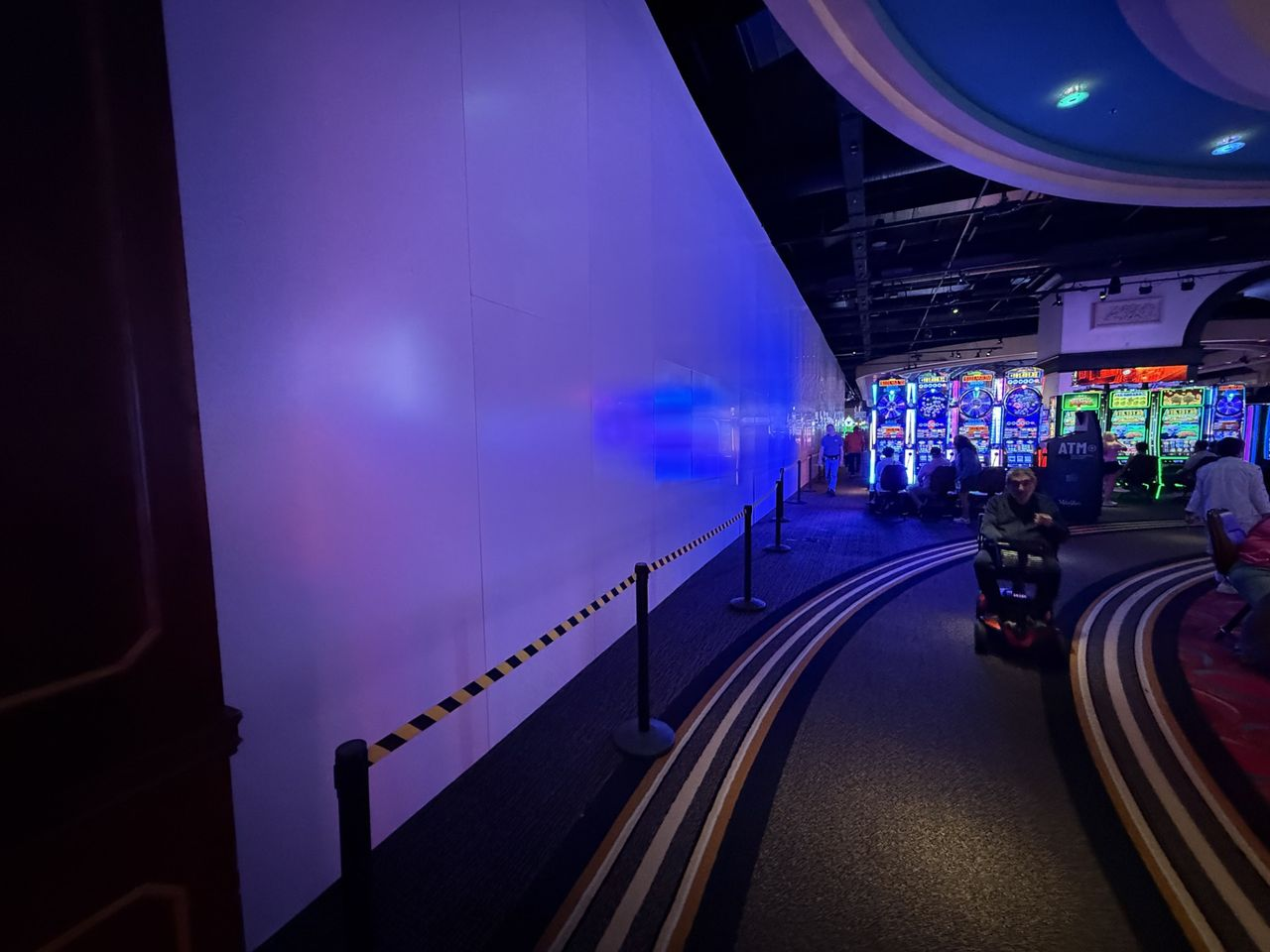 Tall temporary construction walls with a clean finished appearance supporting construction containment and guest safety during casino renovation.