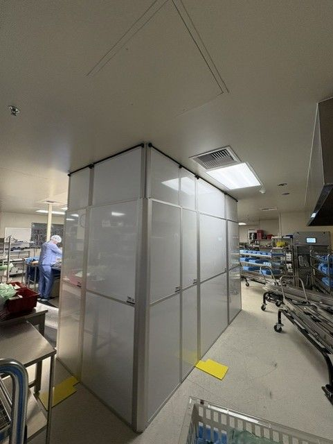 Freestanding modular hard wall containment system installed inside occupied sterile processing department for hospital construction containment