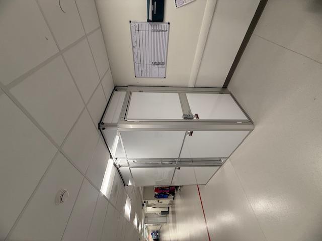 Healthcare containment with clear viewing panel installed in a hospital hallway during renovation