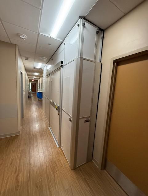 Temporary construction walls separating a hospital hallway from renovation work at Baylor Scott & White Cancer Center