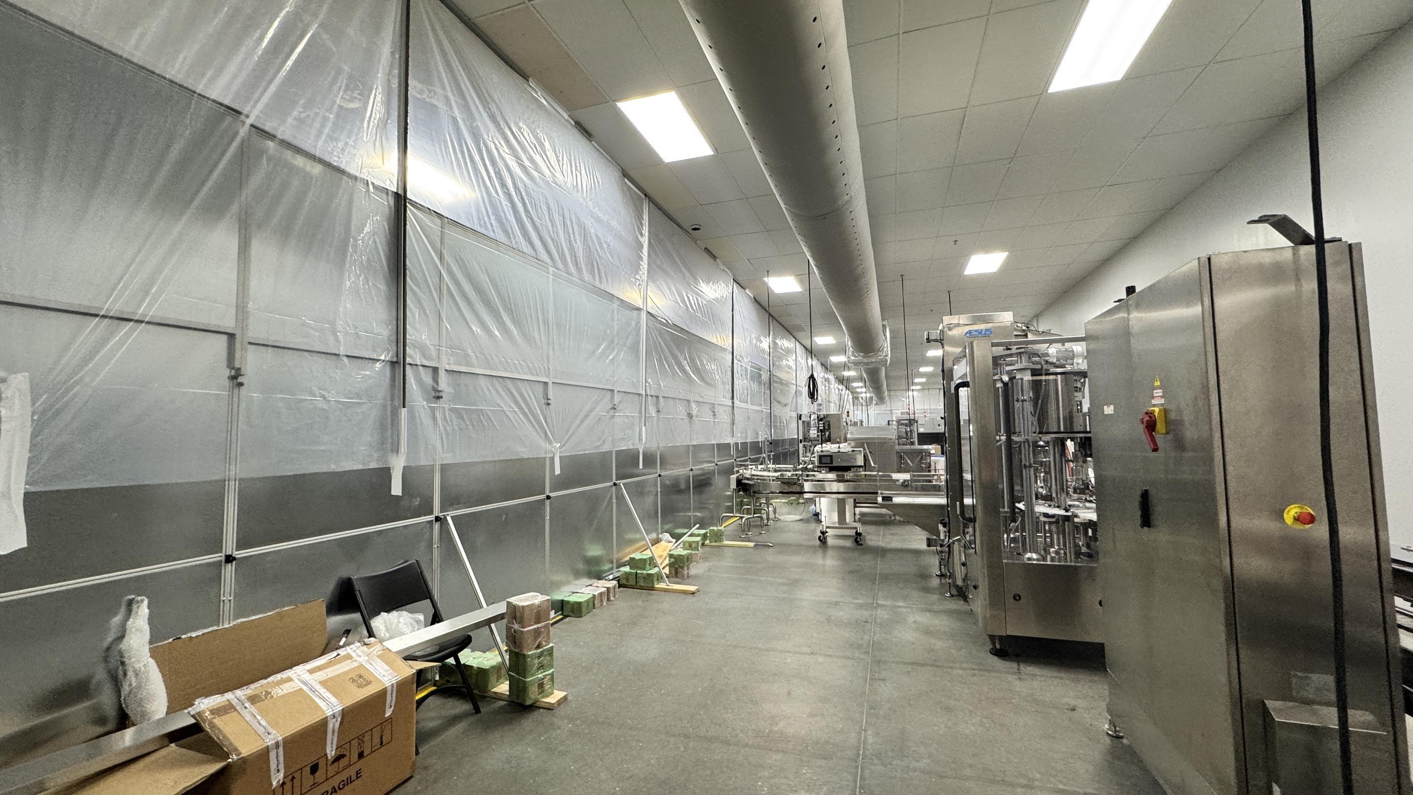 Temporary wall system separating sterile production area from renovation zone