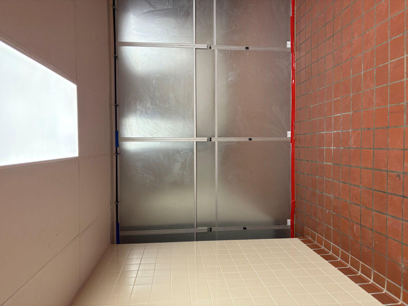 front side of silver temporary wall