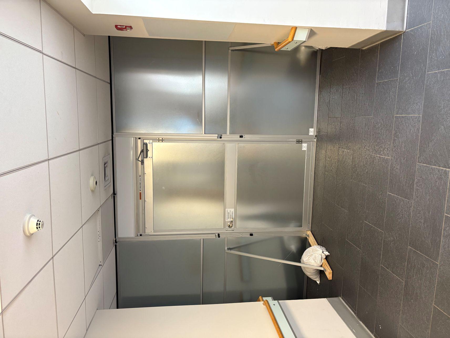 Temporary Wall Systems with Sliding Door and Air Scrubber Support for Complex Renovation Projects