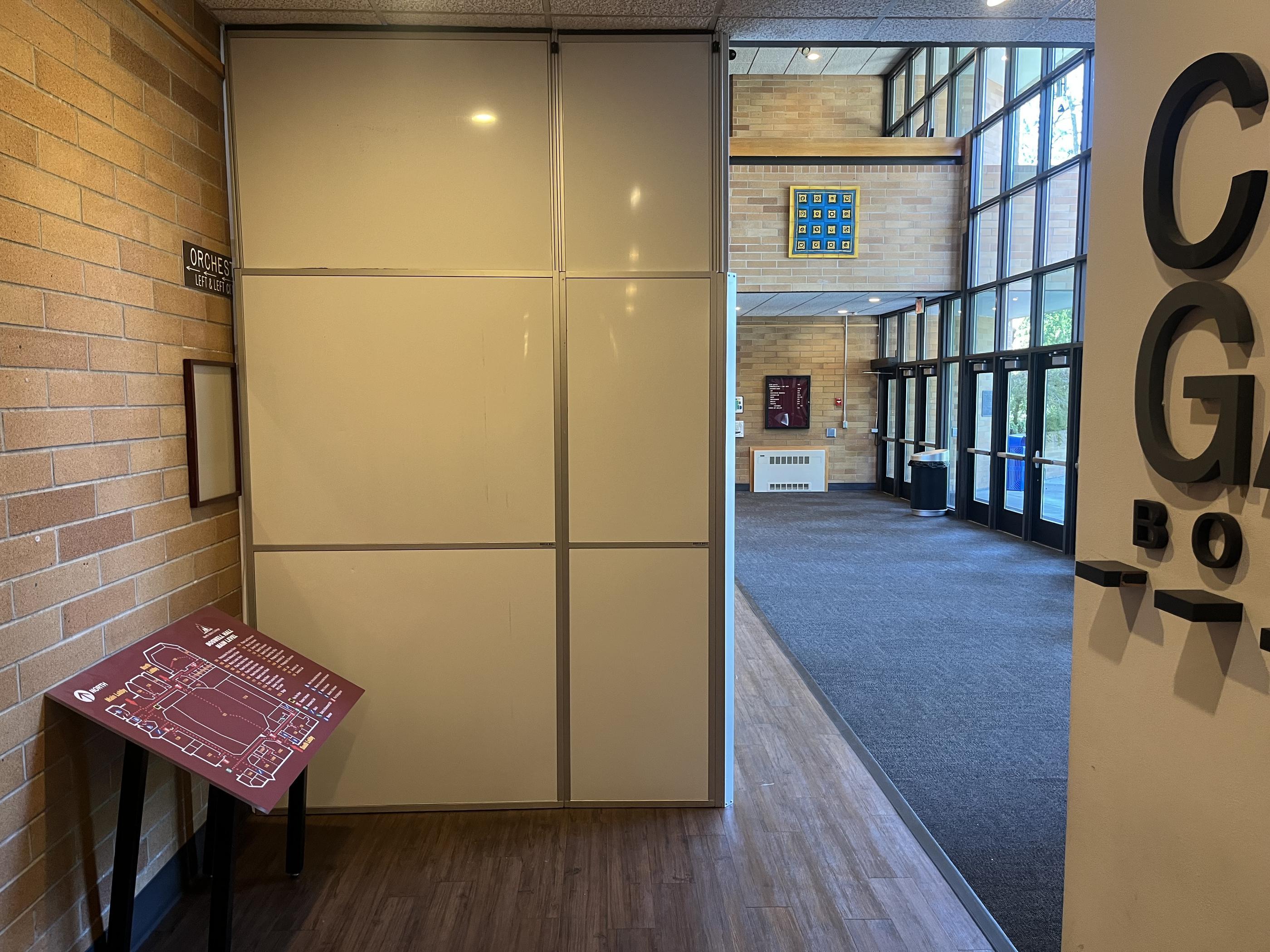 Temporary containment wall installed beside the main entrance and event lobby at Boswell Hall.