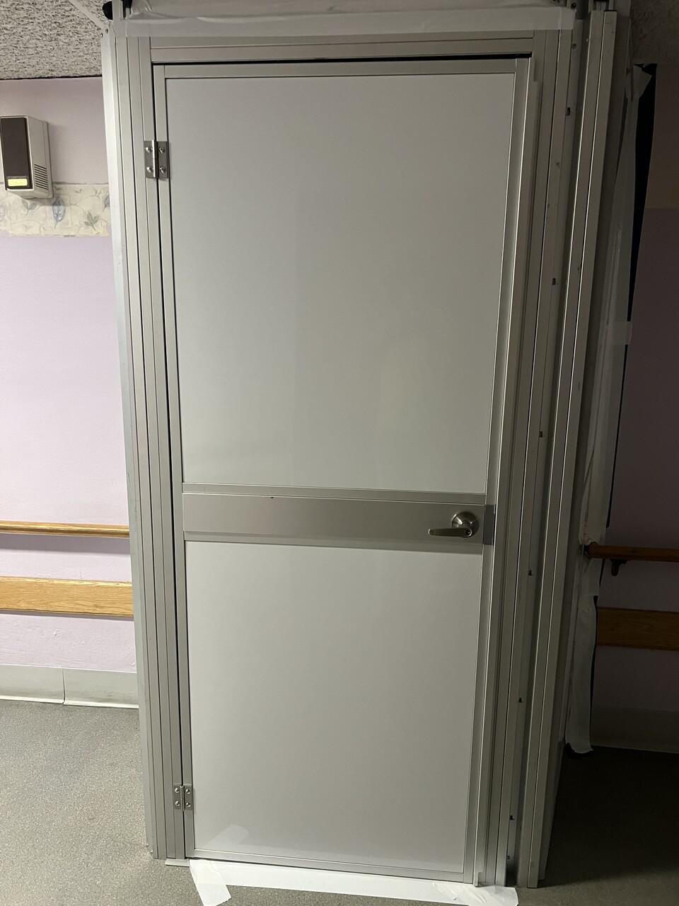Temporary construction containment with sealed transitions and integrated door for healthcare renovation – Temporary Wall Systems St. Louis