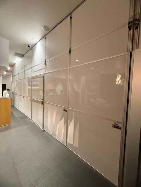 Hard wall containment separating a medical office lobby from construction in Cedar Park, TX