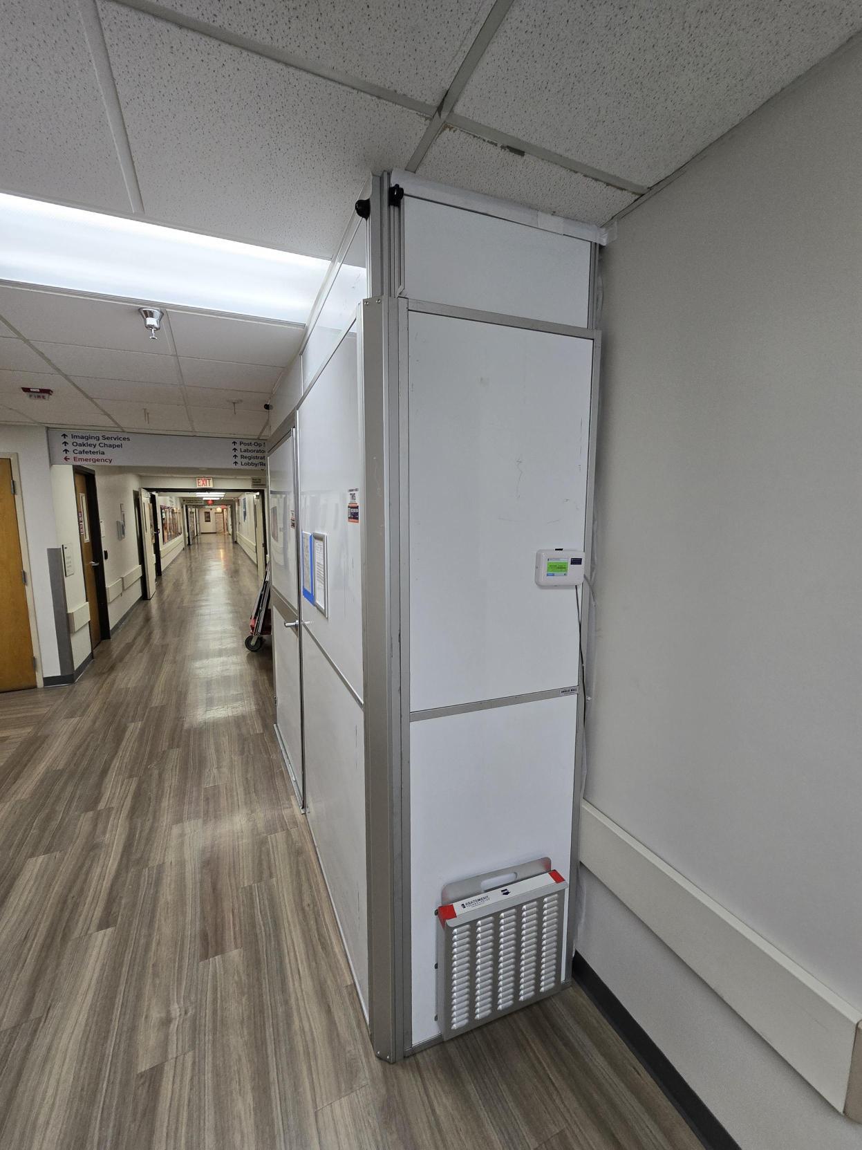 Interior view of healthcare containment with a built-in door and enclosed work area at AdventHealth Dade City.