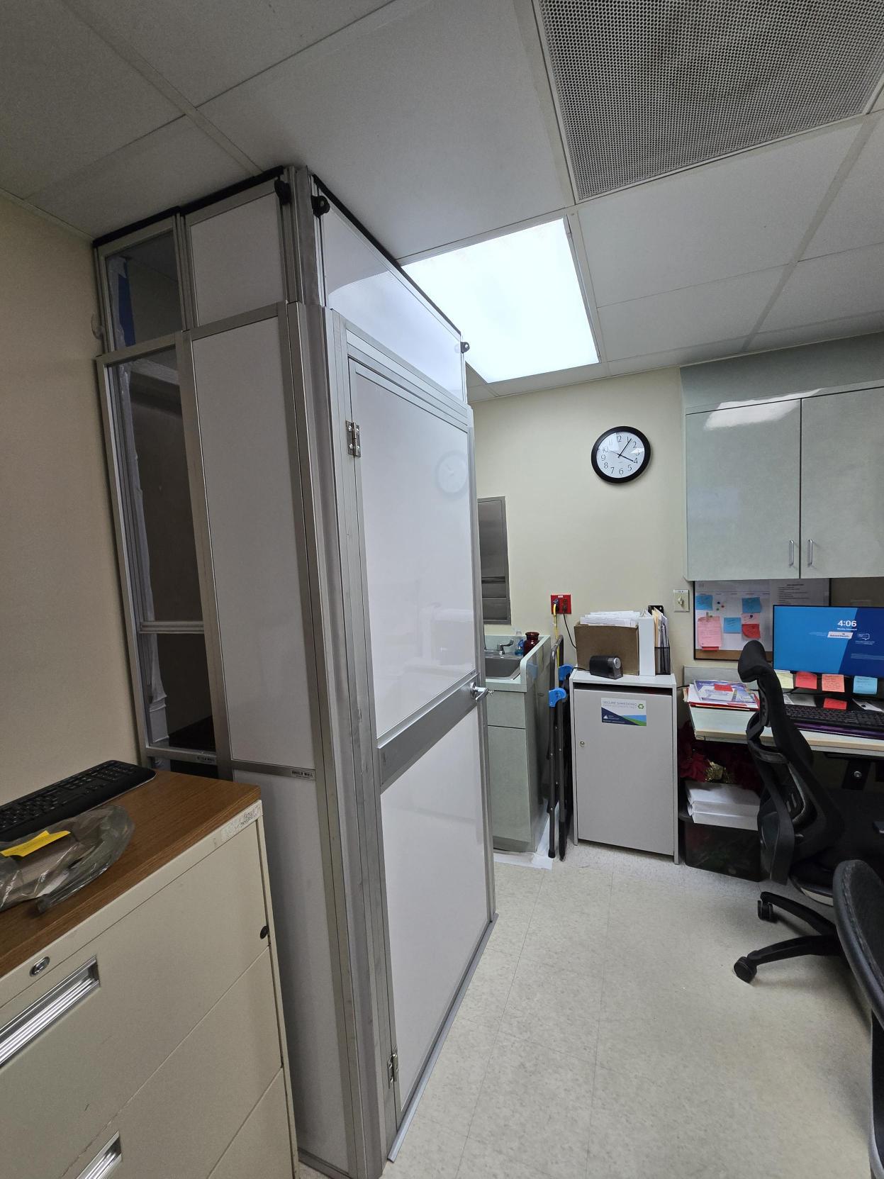 Hospital corridor containment wall installed to separate construction from occupied space during Phase 1 at AdventHealth Dade City.