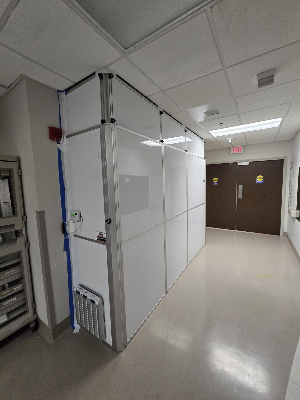 Temporary Wall Systems of Tampa hospital containment setup designed to support dust control in a healthcare hallway.