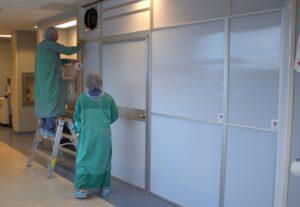 Employees inspecting the negative air pressure room