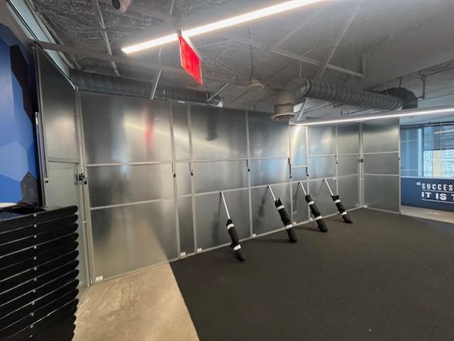 Modular temporary walls dividing a commercial workspace into two areas for an event in Austin, TX