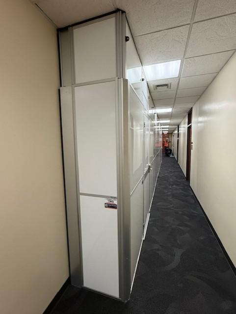 Hard wall containment supporting government office bathroom renovations in downtown Austin