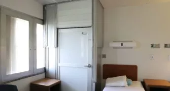 Small temporary room inside a hospital room constructed using Temporary Wall System modular walls.