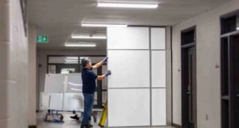Man installing temporary wall systems modular wall