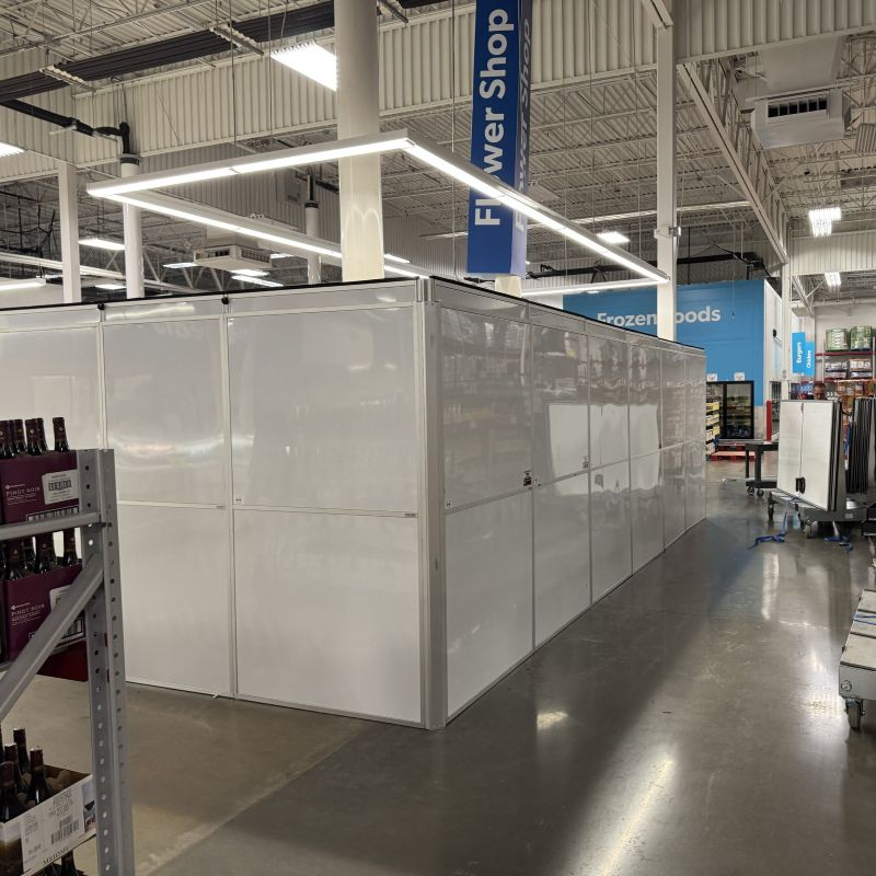 temporary walls in a sams club in front of the flower section