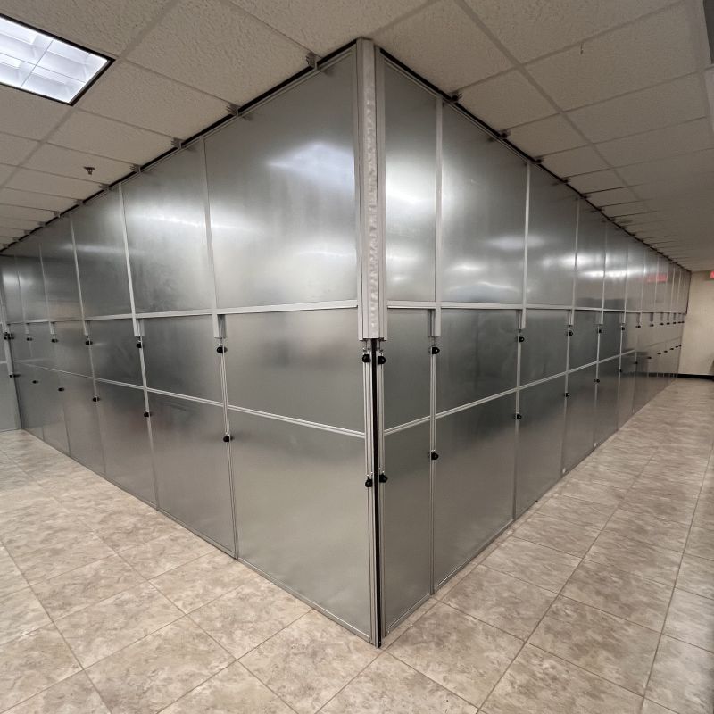 metal backside of temporary walls in a gray color on a carpeted floor